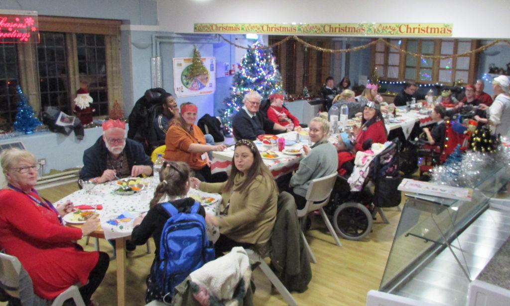 Students and staff having Christmas Dinner at Craig Y Parc School 2019