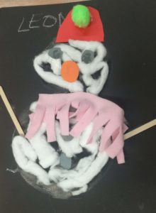 Snowman card with pink scarf and red hat